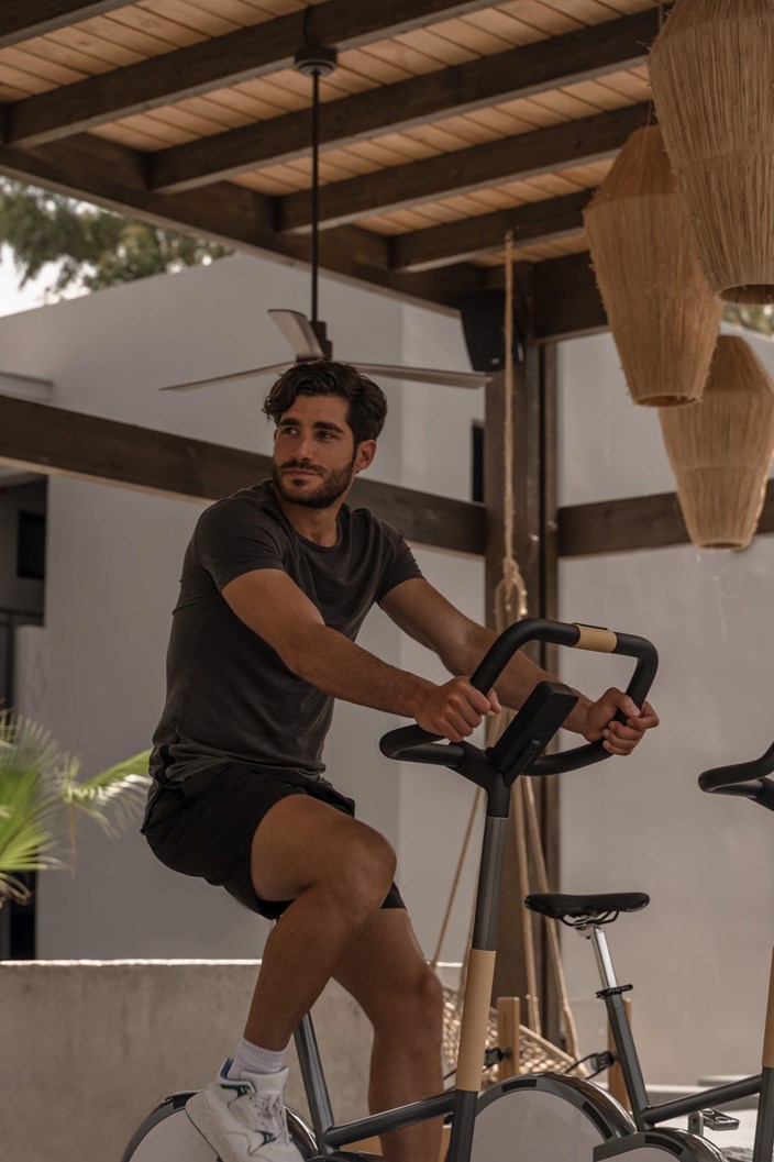 Man On Exercise Bike In The Outdoor Gym At Cook's Club Kolymbia Rhodes