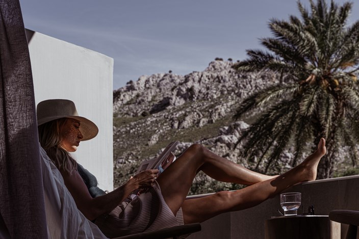 Woman Relaxing And Reading With The Mountains For Her View Cooks Club Kolymbia Rhodes