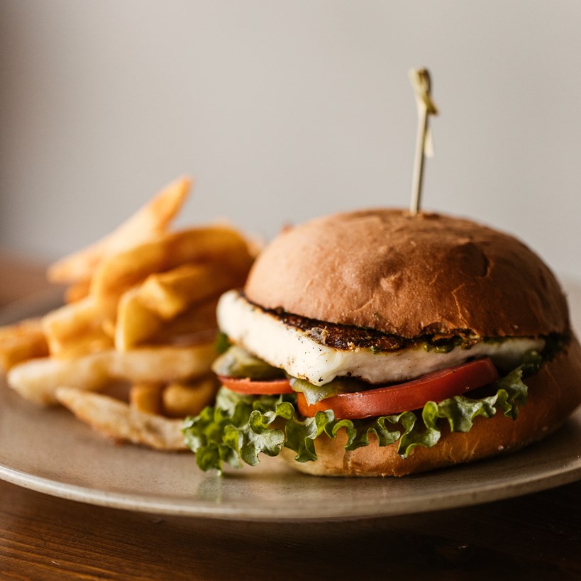 Close up of a burger and fries from the Cook's Club El Gouna menu